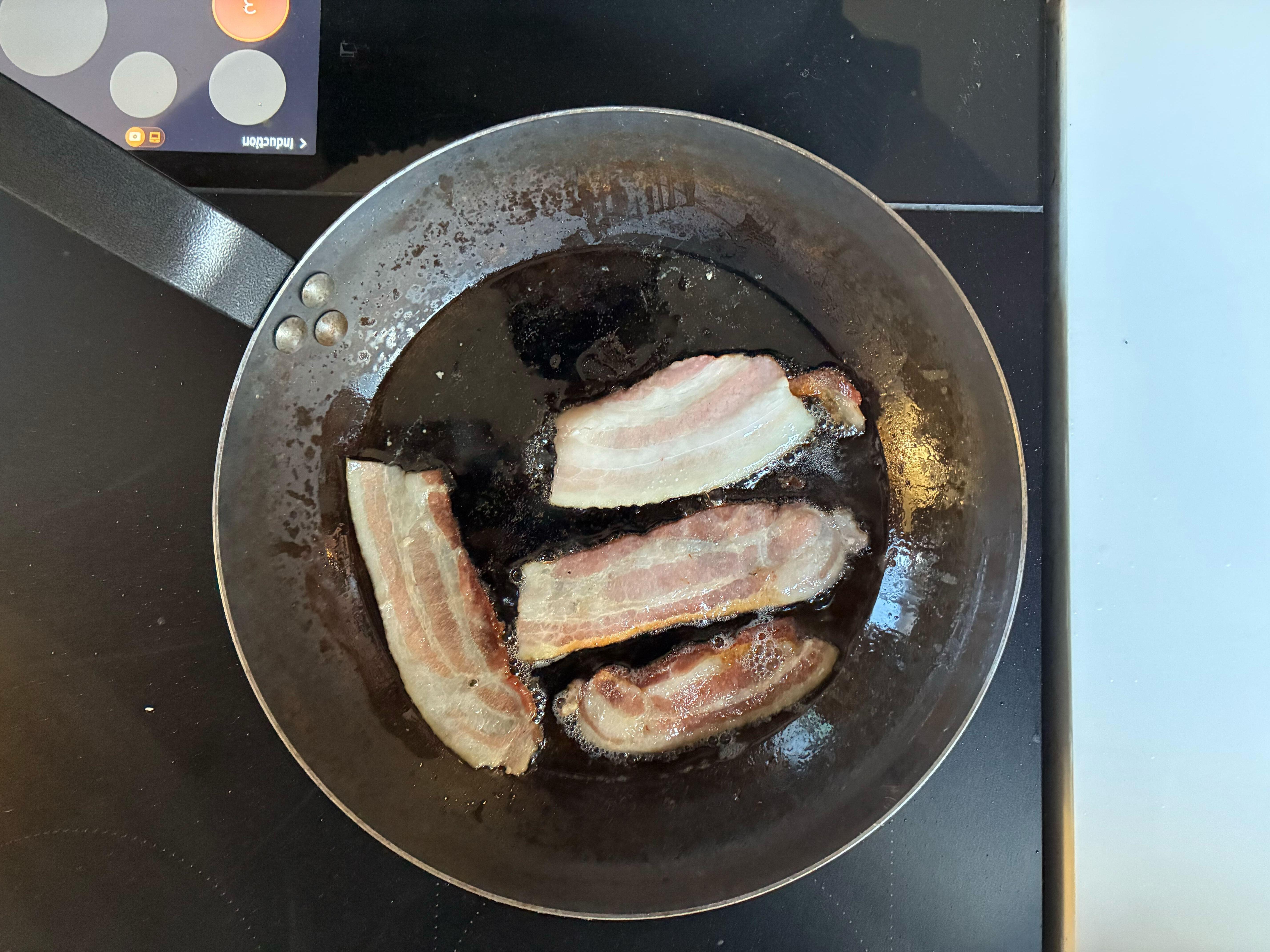 bacon in a frying pan