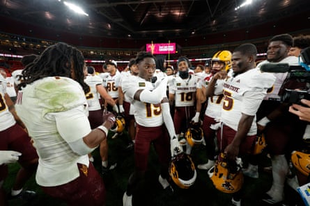 Daquwan Dunn, the defensive back for Arizona State, celebrates with a dance in front of teammates after the game.