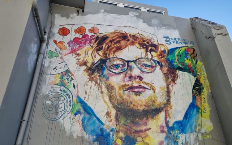 The words "Free Palestine" have been written on the mural.