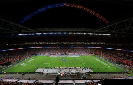 The Wembley Arch is lit up in the colours of the two teams.