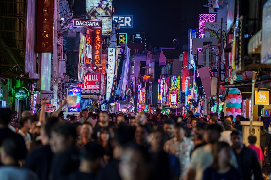 Crowds walking down the street.