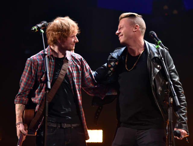 LAS VEGAS, NV - SEPTEMBER 20: Recording artists Ed Sheeran (L) and Macklemore perform ontage during the 2014 iHeartRadio Music Festival at the MGM Grand Garden Arena on September 20, 2014 in Las Vegas, Nevada. (Photo by Kevin Winter/Getty Images for iHeartMedia)