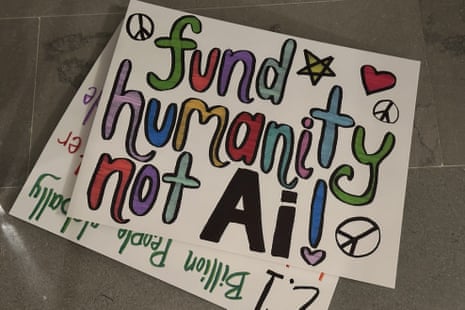 sign says 'fund humanity not ai'