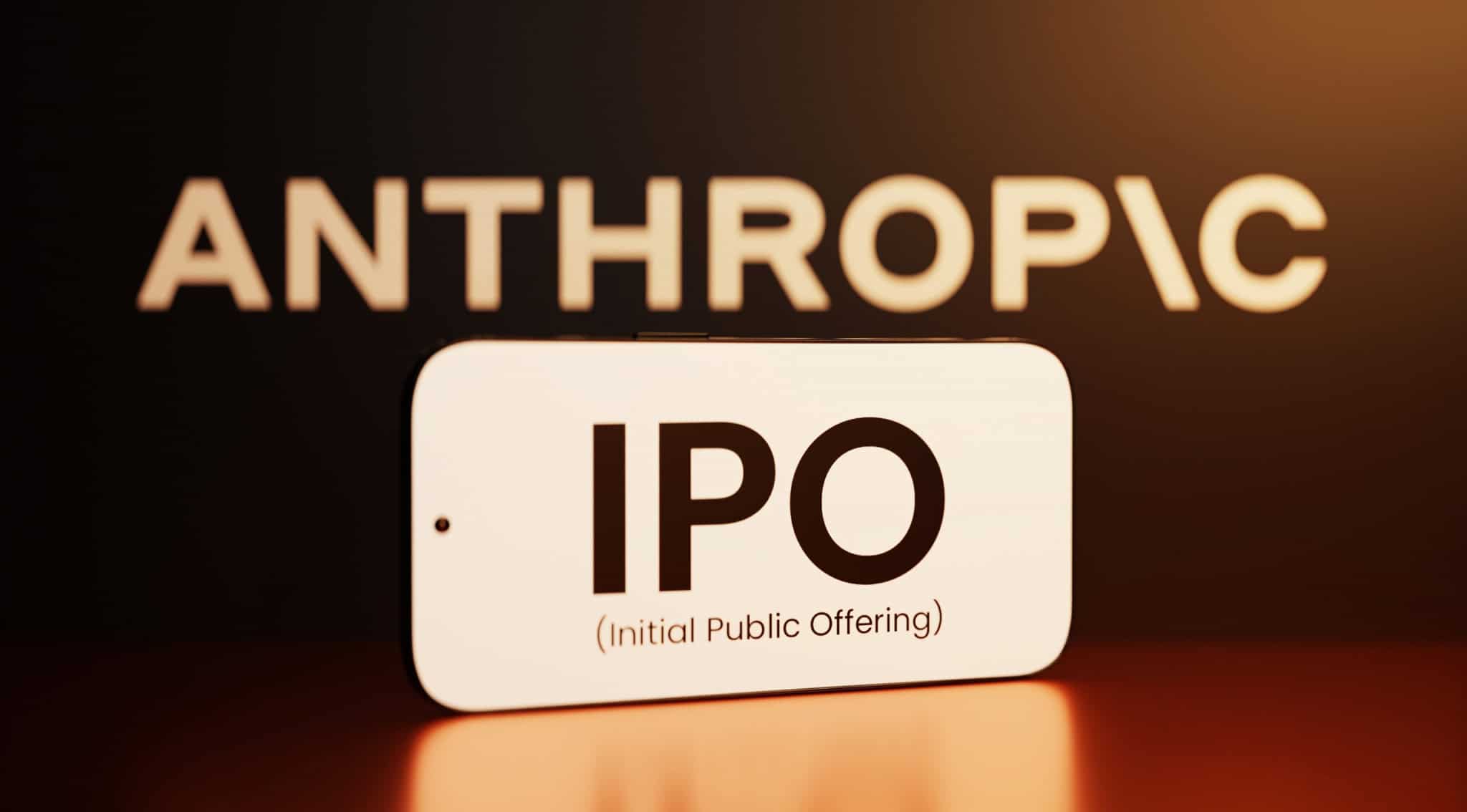 Logo da Anthropic acima; à frente, dizeres "IPO" na tela de um smartphone na horizontal